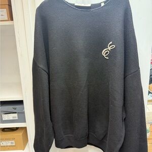 Fear of God Men's Black Crewneck Sweater with Cream Emblem